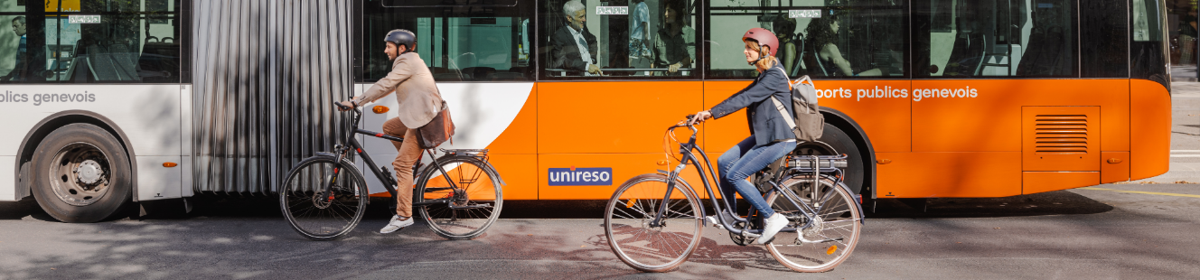 Photo of people cycling in front of a bus